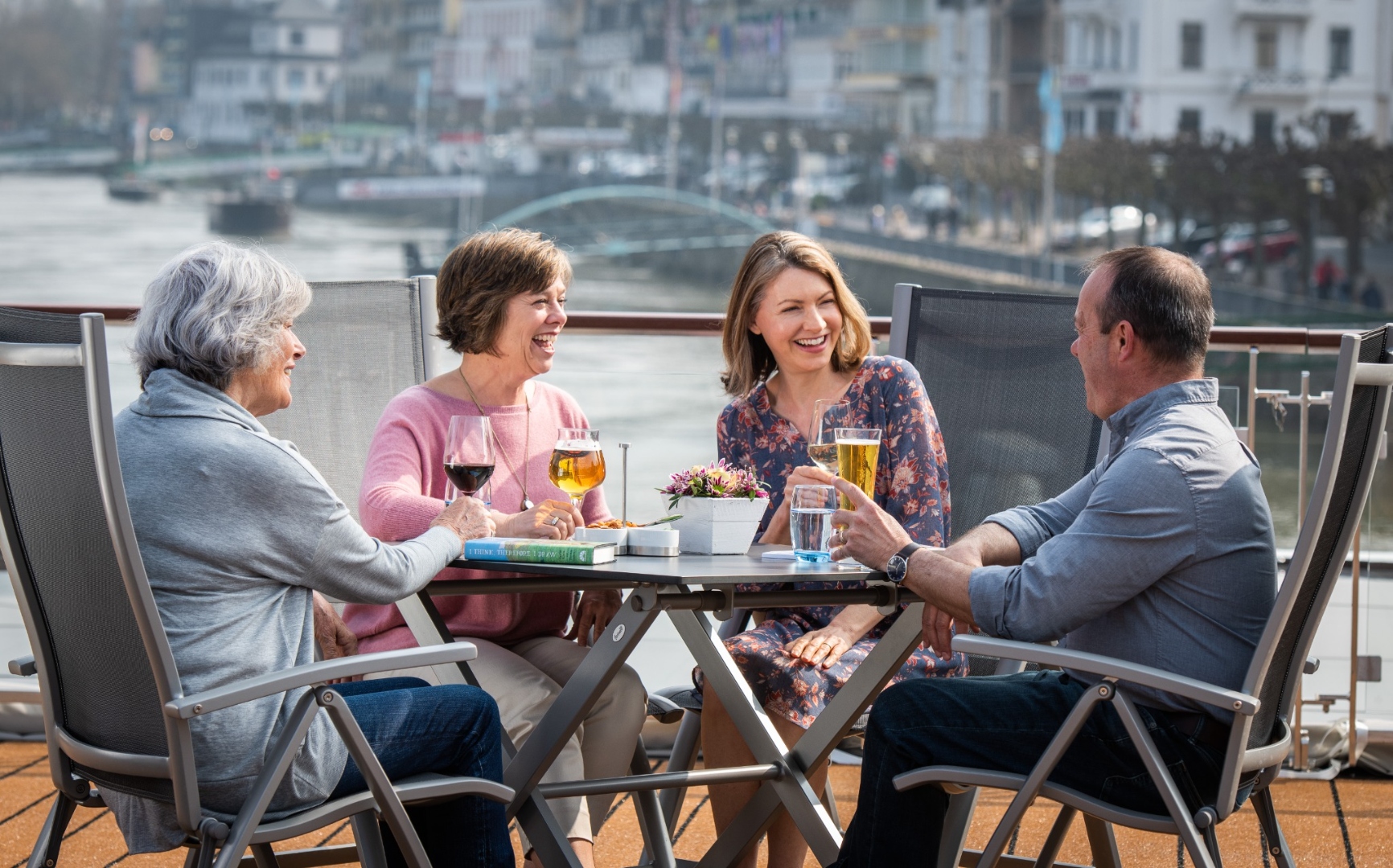 Guests dining on a Viking longship sun deck